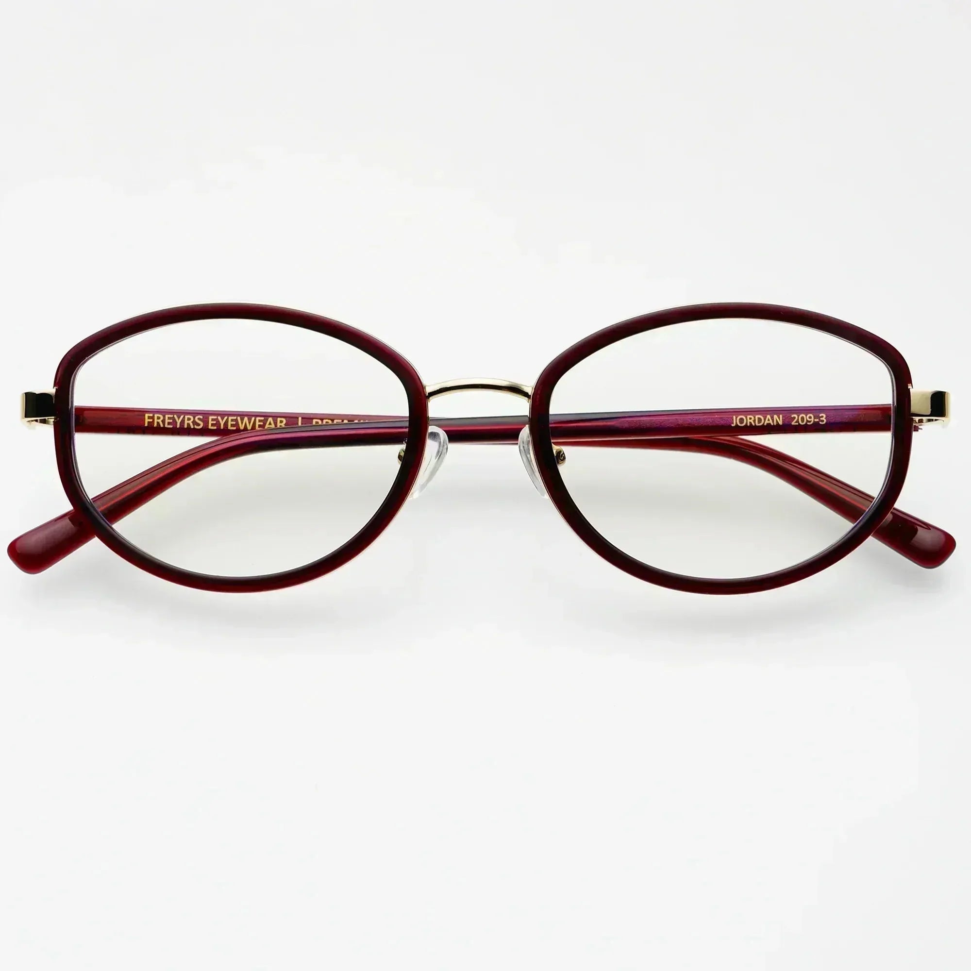 Freyrs Jordan bold modern blue light reading glasses with maroon oval frames and gold accents on a white background.
