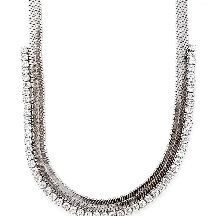 Silver crystal snake chain necklace with two intertwined strands, one featuring a sleek metal design and the other adorned
