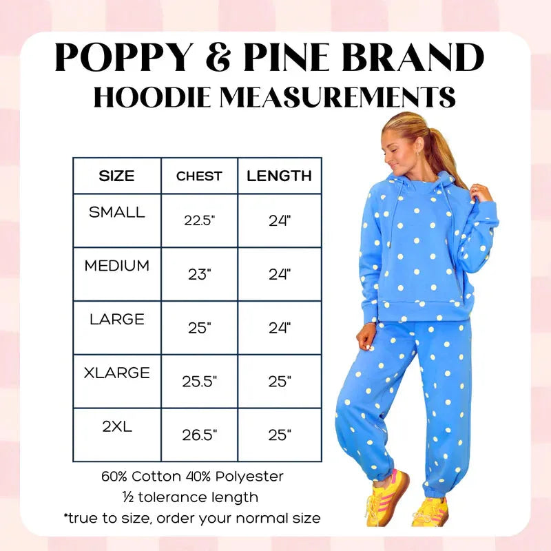 Poppy and Pine blue sweatsuit with white polka dots. Model wearing size Medium. Size chart shown with chest and length