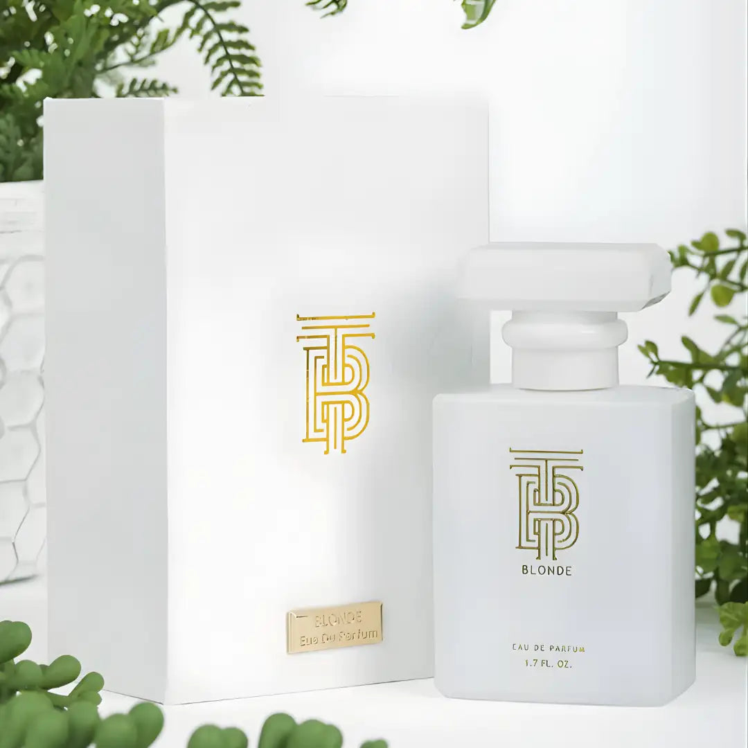 White rectangular perfume bottle with gold logo and ’blonde’ inscription, featuring a matching white cap.